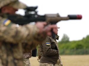 Ukrainian army personnel with members of the UK Armed Forces during a training session learning dog handling techniques at a barracks in the East Midlands in September