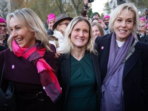 Kim Leadbeater (centre) with cancer patient Sophie Blake (left) and Esther Rantzen's daughter, Rebecca Wilcox after hearing the result of the vote in parliament for her Terminally Ill Adults (End of Life) Bill in Westminster in November 2024