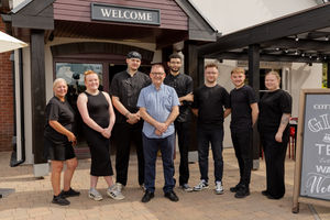 Team outside the front of the new-look pub