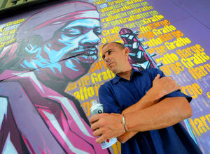 Graffitti artist Steve Edwards pictured next to his work depicting Jimi Hendrix.