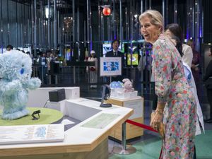 Supporting image for story: Duchess of Edinburgh interacts with robot dog during Japan visit
