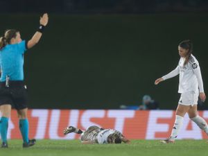 Real Madrid’s Melanie Leupolz lies on the ground after getting hurt during the Women’s Champions League quarterfinal first leg soccer match between Real Madrid and Arsenal