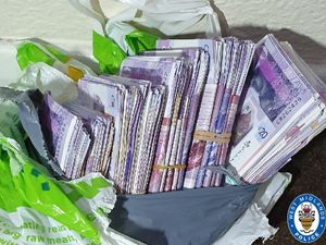 Supporting image for story: Suspected illegal cash stash seized after car crash