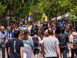 Crowds of people on a street in Madrid, Spain