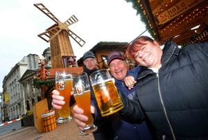 Susan Small with Gerry Purnell and Lee Jones from Moseley celebrate the return of the Frankfurt Christmas Market. All pictures: Steve Leath