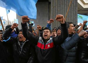 Demonstrators shout and chant during a protest in Crimea, Ukraine