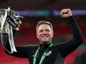 Newcastle United manager Eddie Howe holding the Carabao Cup trophy