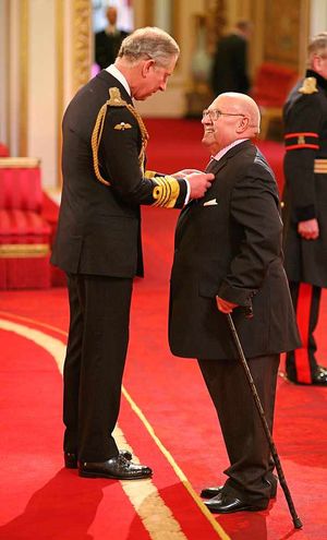 Peter Holmes, from Wolverhampton, is made an MBE by the Prince of Wales for services to sport in the West Midlands and to the community in Wolverhampton,