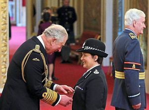 DCC Rolfe receiving her OBE at Buckingham Palace