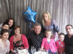 Mihalis - pictured surrounded by his family - "lived for his grandchildren"