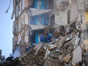 Supporting image for story: Kyiv rescuers find more bodies as death toll from Russian missile attack climbs