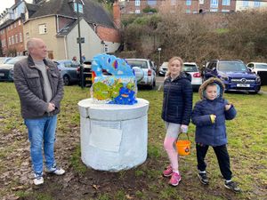 Julia Buckley and her family pictured after the sculpture had been cleaned