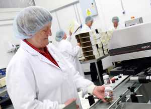 Rose Broome packing sweets at the Tenbury Wells site