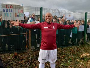 Roberto Carlos poses after greeting pupils from Hanwood's primary school who turned out in force