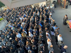 Imam addressing some of the mourners at the mission centre 