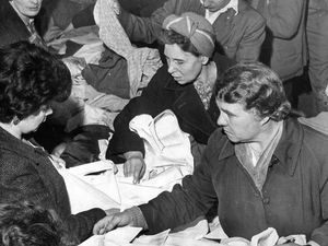 1962 - The rush is on, and there are bargains galore at the Codsall Roman Catholic Church jumble sale held at the Crown Hotel, Codsall.