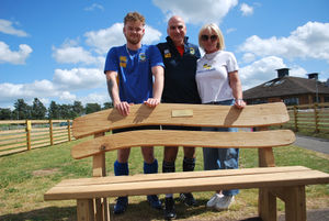 From left to right Alastair's son Harry, Stourport Hockey Club Chairman Martin Tucker, and Alastair's widow Karen unveil the new bench