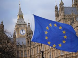 The European Union flag flying in front of the Houses of Parliament in Westminster, London