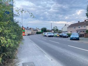 The police opposite the filling station and garage in St Martins