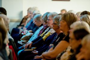 The audience listens to Jodi