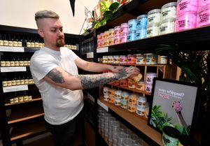 Ryan stocks the shelves at COW Home & Body in Hednesford