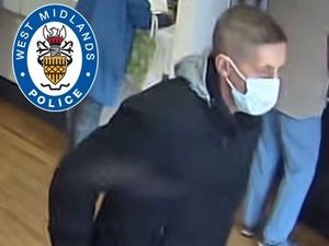 Supporting image for story: Woman had cash 'wrestled out of hand in bank' - police release image to find man