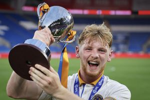 Jack Loughran of Shrewsbury Town celebrates with the Professional Development League Trophy (AMA)