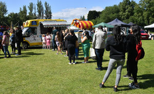 Visitors waiting in the long queue for the ice cream man.