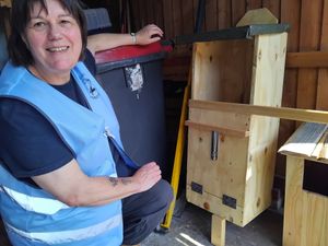 Marion Versluijs with two owl boxes which the Friends of Hurley Brook plan to place in trees around the waterway. Picture: LDRS