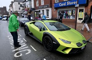 Visitors to the Bridgnorth Italian Moto Fest brave the horrendous downpours to view the cars on show.A Lamborghini on show