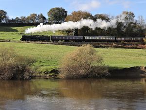 BR Standard 75069 passes the river Severn near Arley.  