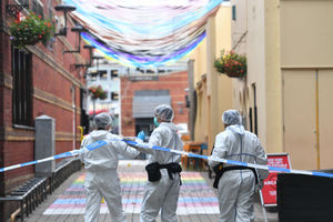 Police forensics officers at work in Hurst Street, in Birmingham after a number of people were stabbed in the city centre