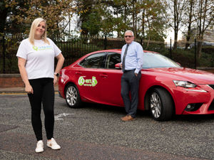 Supporting image for story: Taxi firm's donation to charity