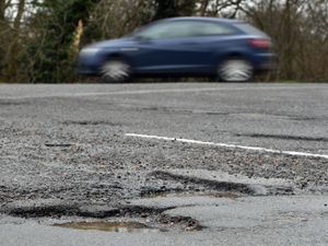 A car near a pothole