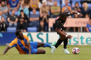 Shrewsbury Town's Aaron Pierre and Leicester City's Abdul Fatawu d
