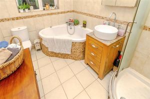 The spacious bathroom with shower unit