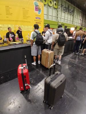 Passengers bring their suitcases to the beer festival