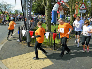 Supporting image for story: Just 55 steps as world's shortest fun run takes place in Burntwood