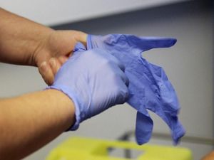 Supporting image for story: Car dealer supplies nurses with seat covers and gloves