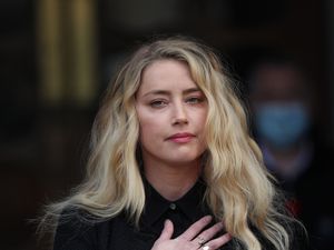 Supporting image for story: Amber Heard says she still loves Depp but fears further defamation lawsuits