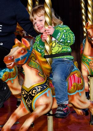 A youngster enjoying the fairground ride.