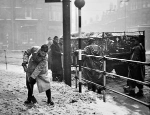 A German POW clearing snow in Princes Square, Wolverhampton, in January 1947.