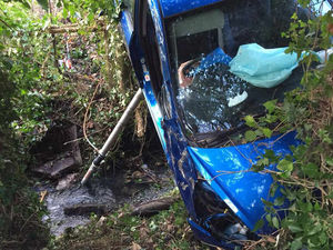 Supporting image for story: Firefighters cut woman free after Shropshire crash leaves car suspended over brook
