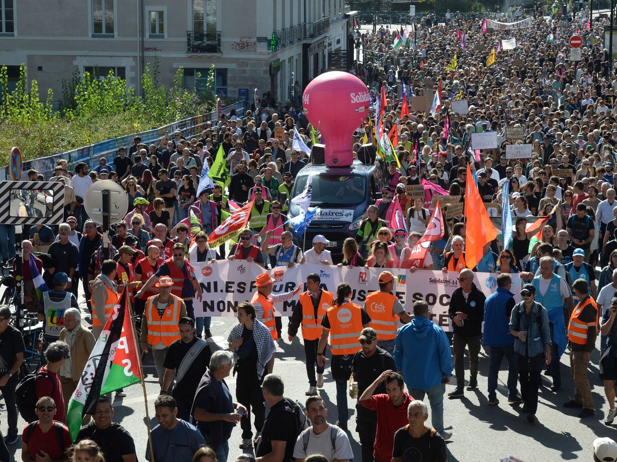France hit by protests and strikes over Macron’s public service cuts