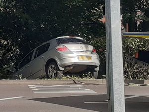 Supporting image for story: Woman hurt as car ends up in hedge in Telford crash