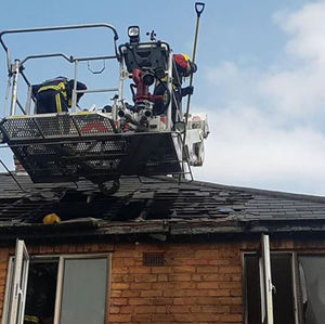 The firefighters were eventually helped down. Picture: Andrew Birch