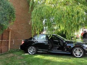 Supporting image for story: Car rolls down steep drive and hits house
