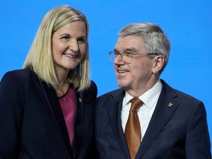 IOC president Thomas Bach, right, greets Kirsty Coventry after she was announced as the new IOC President at the International Olympic Committee 144th session in Costa Navarino, western Greece.