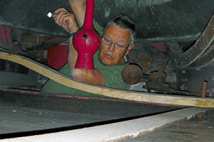 A tight squeeze in the belfry for acting tower captain Colin Jones to apply grease to a clapper