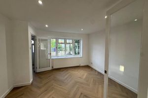 A bright and welcoming living room offering a comfortable space to relax and unwind